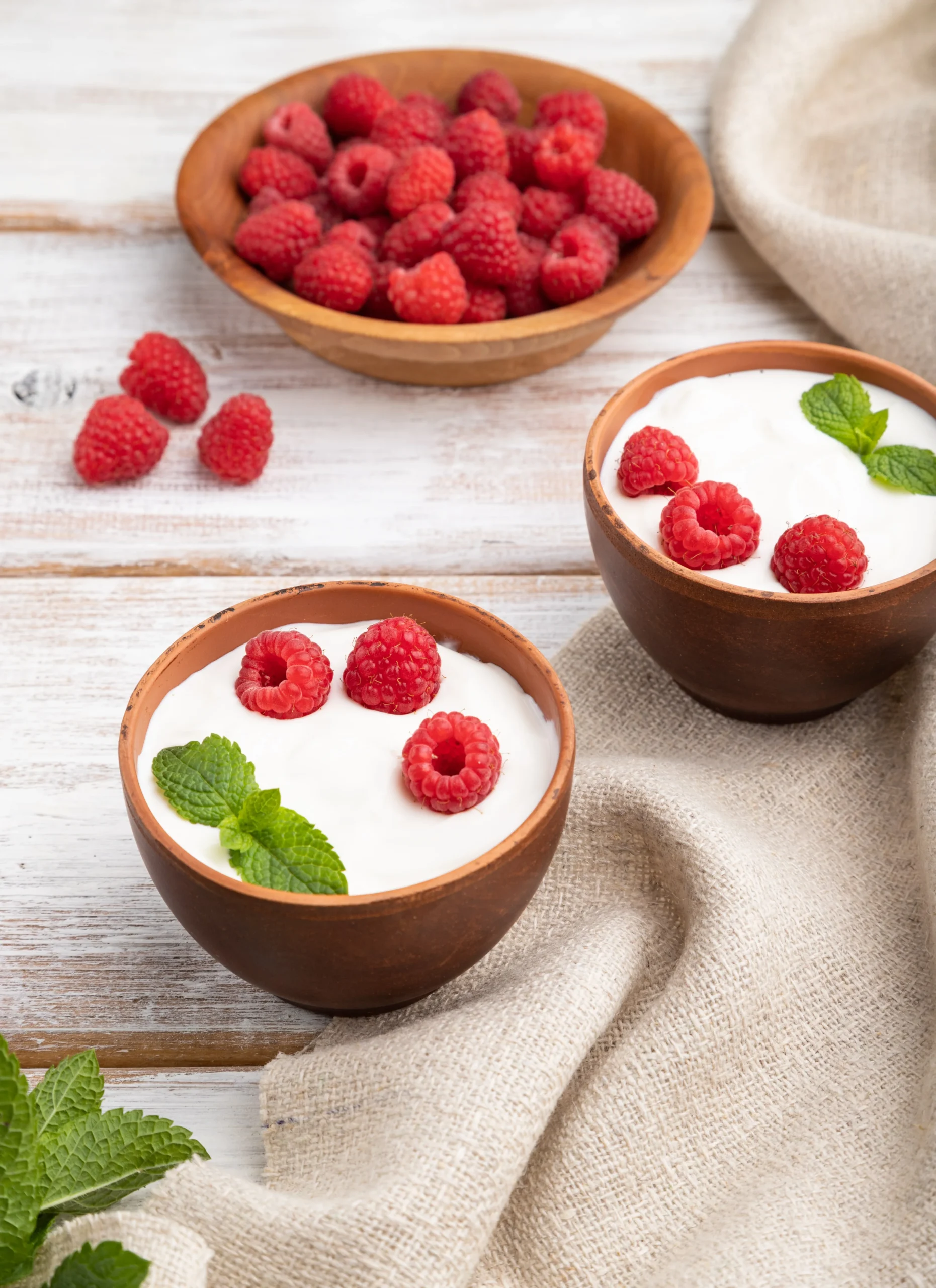 yogurt-with-raspberry-in-clay-cups-on-white-wooden-2025-03-13-05-47-04-utc